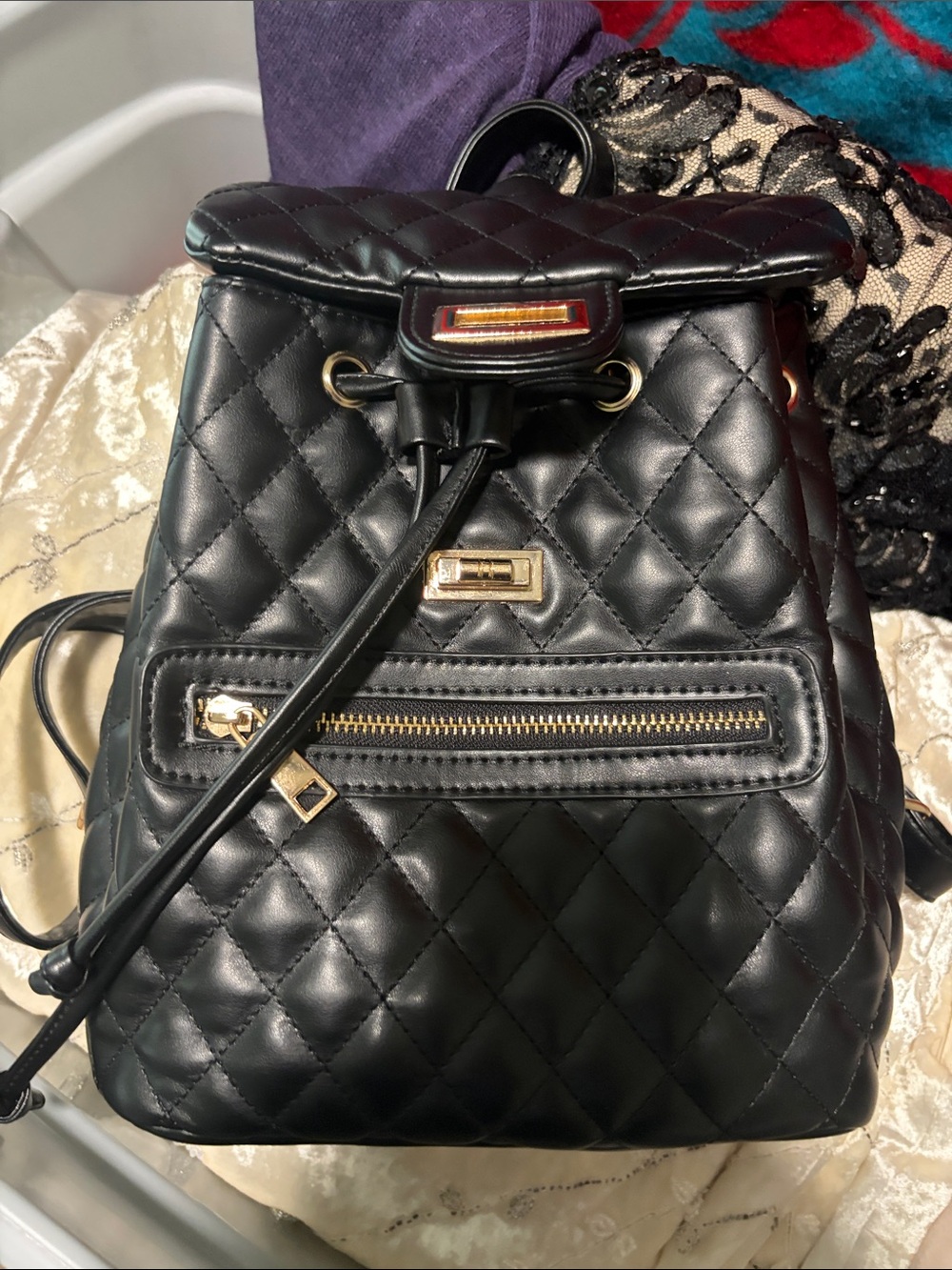 Quilted Black Drawstring Backpack with Gold Hardware